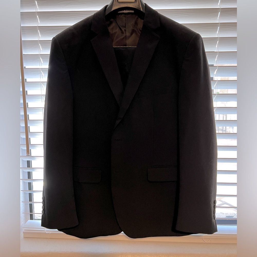 Black men’s suit. Tailored chest at 44S, waist at 32x30. Worn once.